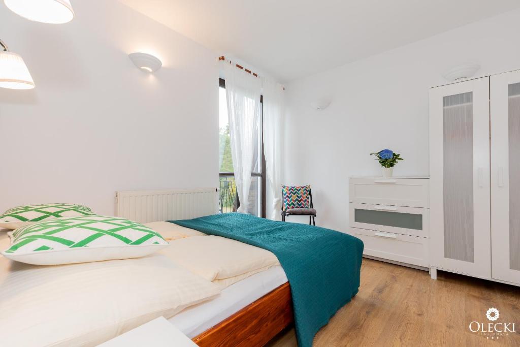 Posteľ alebo postele v izbe v ubytovaní OLECKI Holiday House