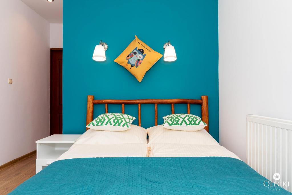 Posteľ alebo postele v izbe v ubytovaní OLECKI Holiday House