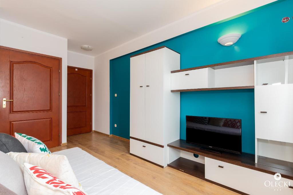 Posteľ alebo postele v izbe v ubytovaní OLECKI Holiday House