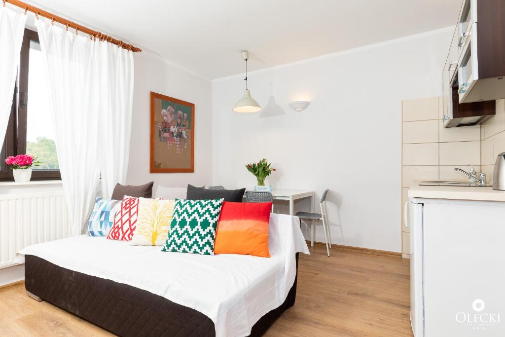 Posteľ alebo postele v izbe v ubytovaní OLECKI Holiday House