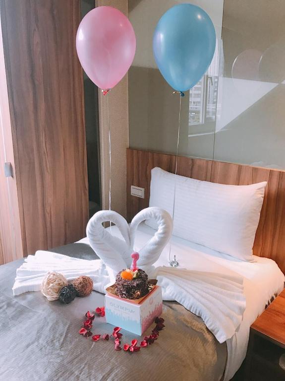 Postel nebo postele na pokoji v ubytování Ximen Hotel B