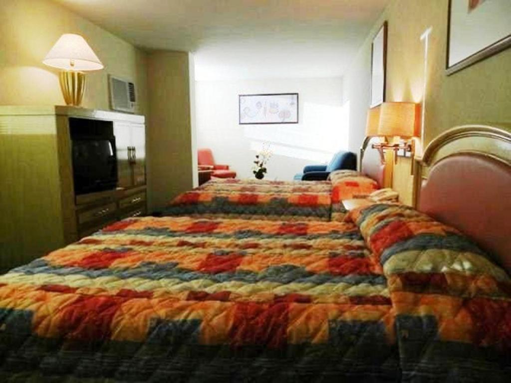 Cama o camas de una habitación en Hotel San Francisco Irapuato Business Class