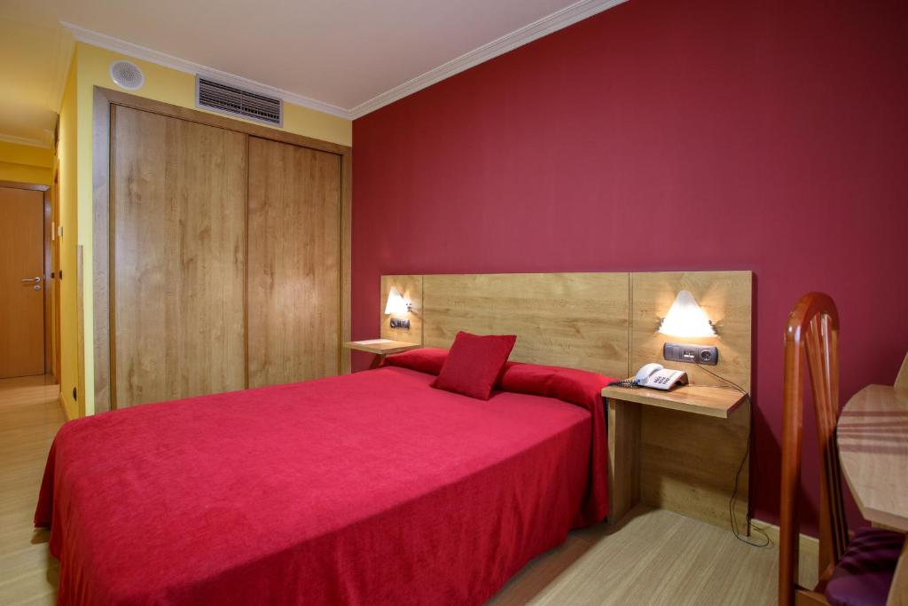 Postel nebo postele na pokoji v ubytování Hotel Restaurante Pontiñas