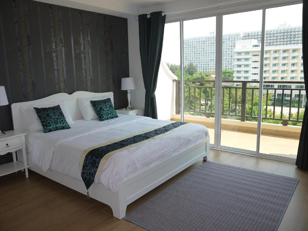 Postel nebo postele na pokoji v ubytování Jomtien Beach Penthouses