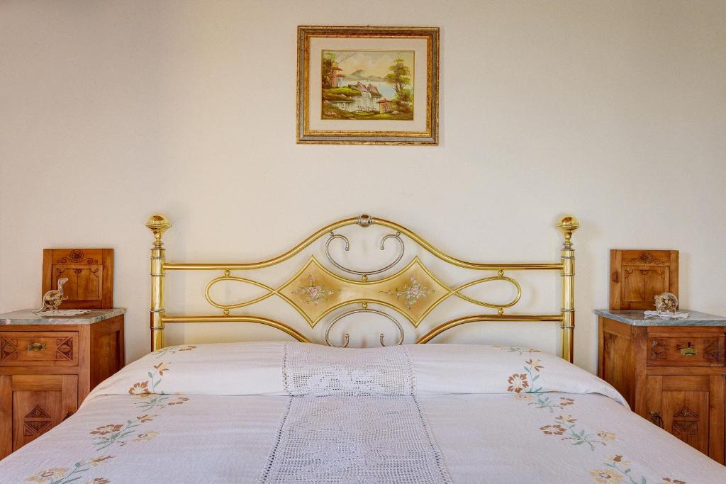 Łóżko lub łóżka w pokoju w obiekcie SacroFanum Villa