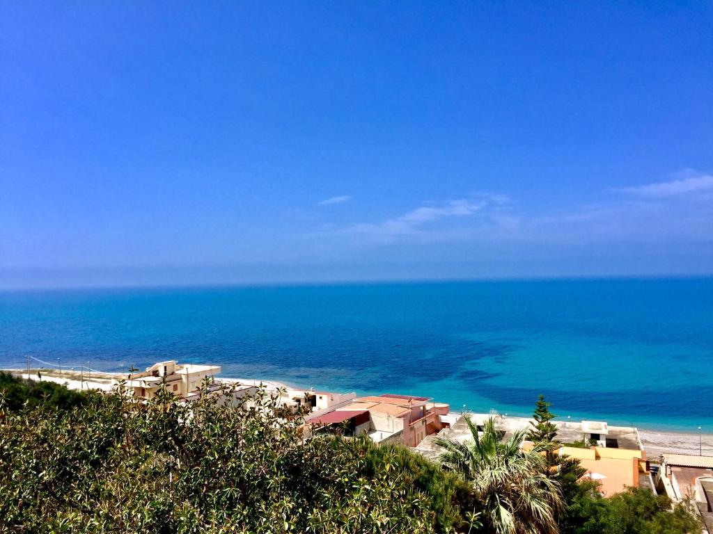 a view of a beach with the ocean in the background at La Casa di Carta in Borgo Bonsignore