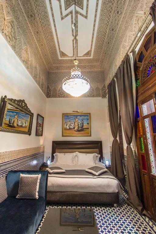 Postel nebo postele na pokoji v ubytování Riad Fes Andalucia