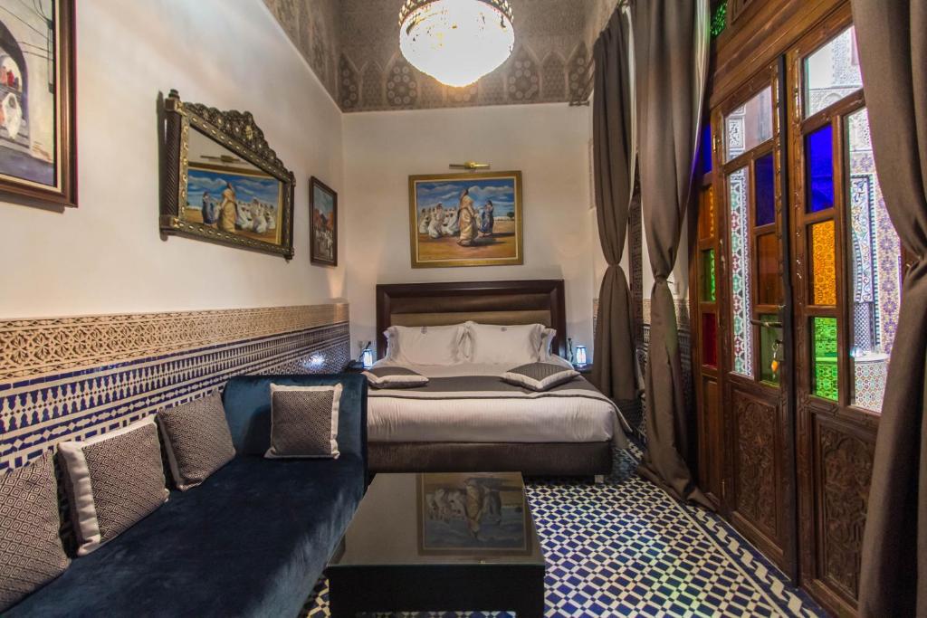Postel nebo postele na pokoji v ubytování Riad Fes Andalucia