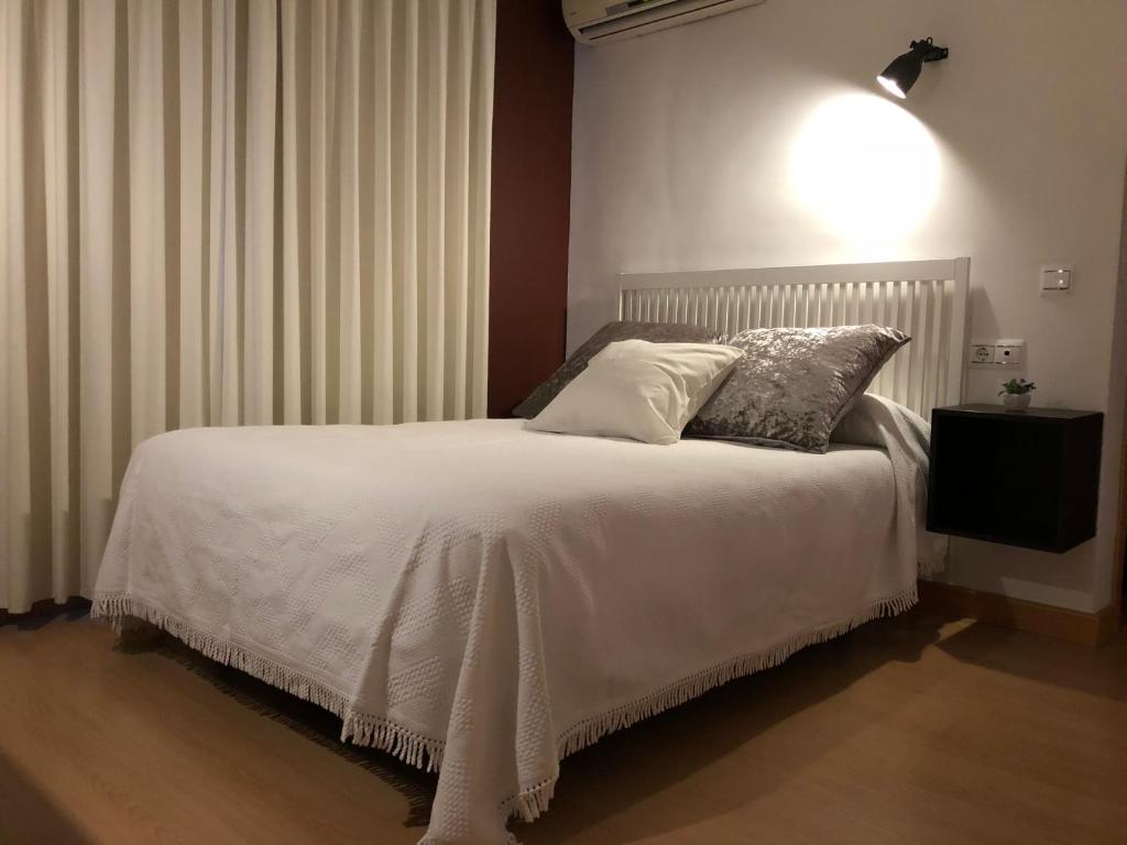 Postel nebo postele na pokoji v ubytování Loft Almagro