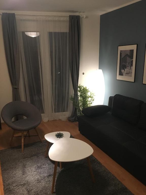 Posezení v ubytování Lake Apartment