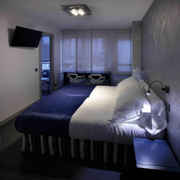 Posteľ alebo postele v izbe v ubytovaní Hostal Averroes
