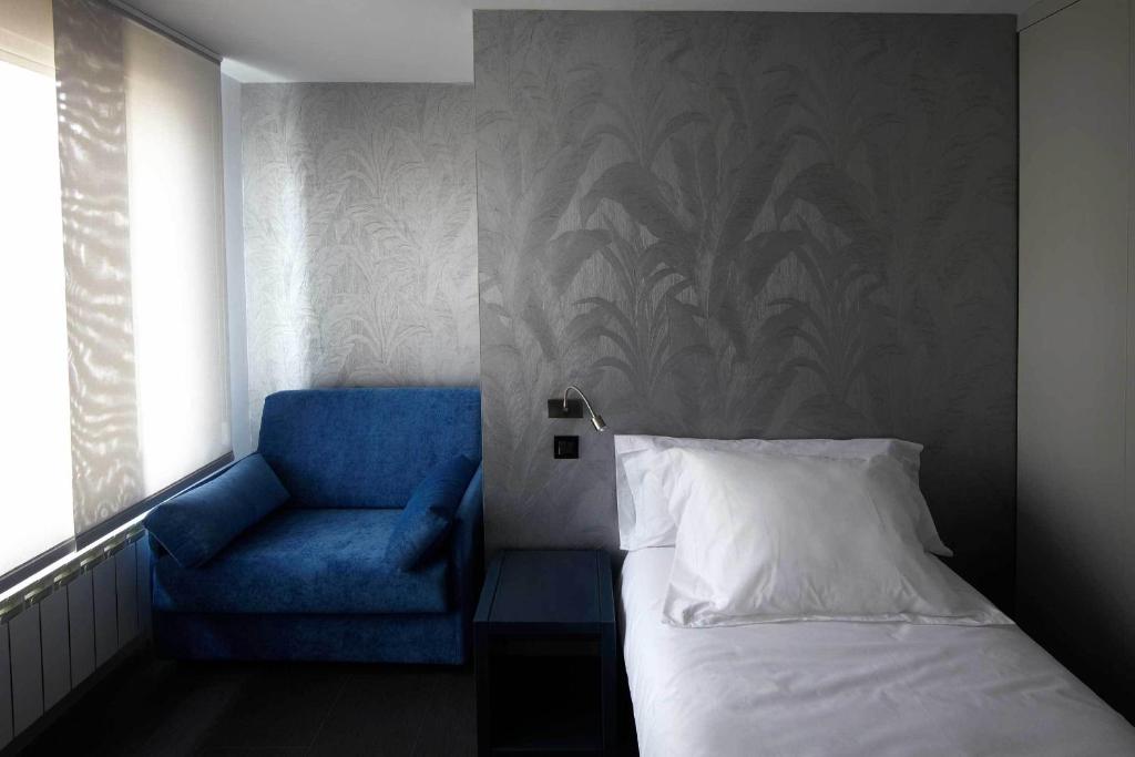Posteľ alebo postele v izbe v ubytovaní Hostal Averroes