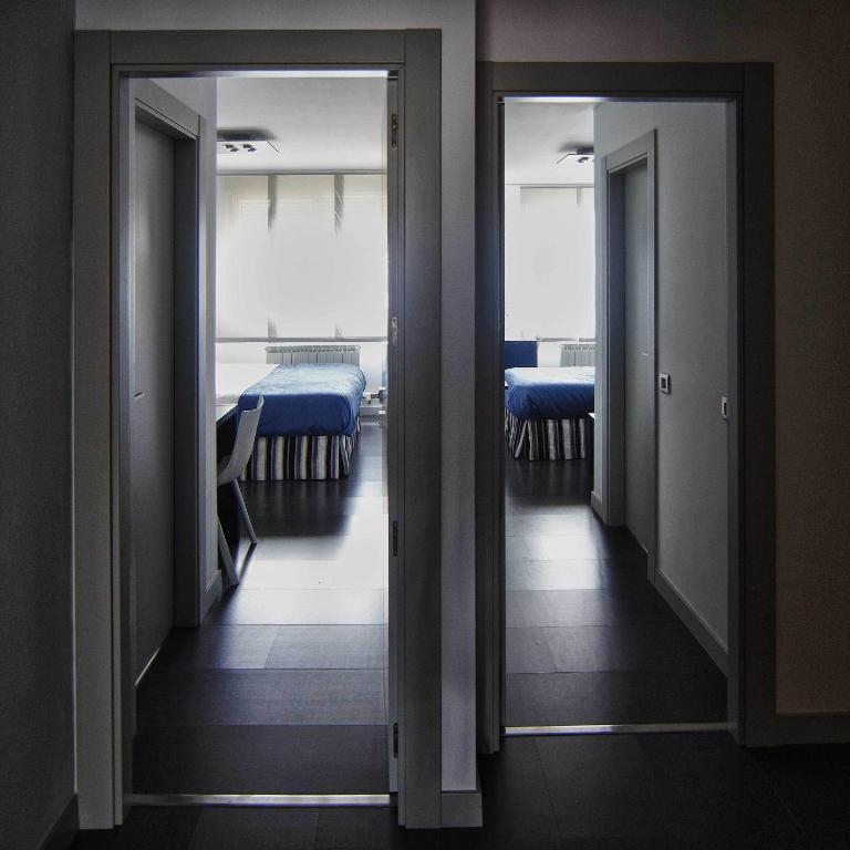 Posteľ alebo postele v izbe v ubytovaní Hostal Averroes