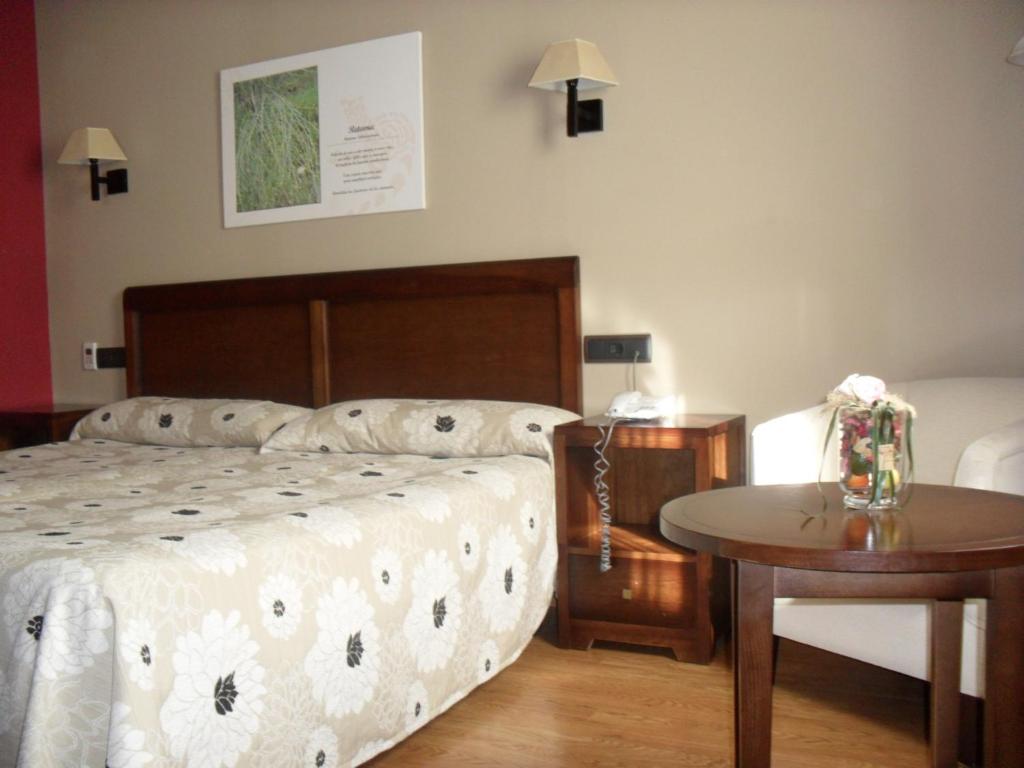 Postel nebo postele na pokoji v ubytování Hotel Zerbinetta