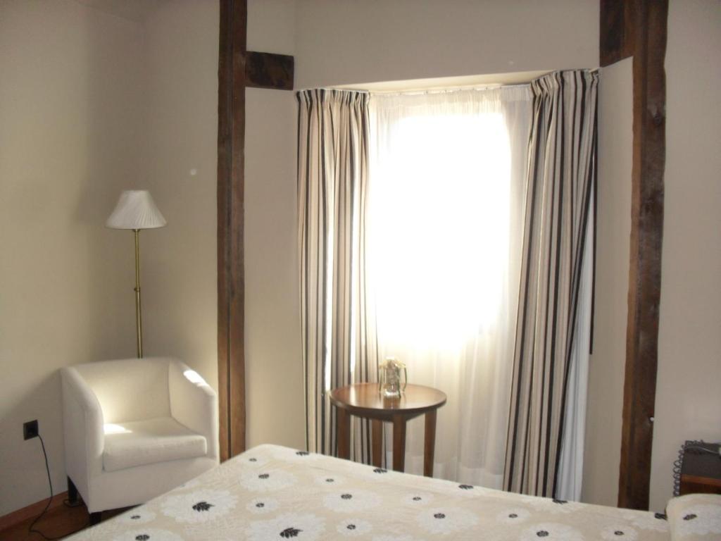 Postel nebo postele na pokoji v ubytování Hotel Zerbinetta