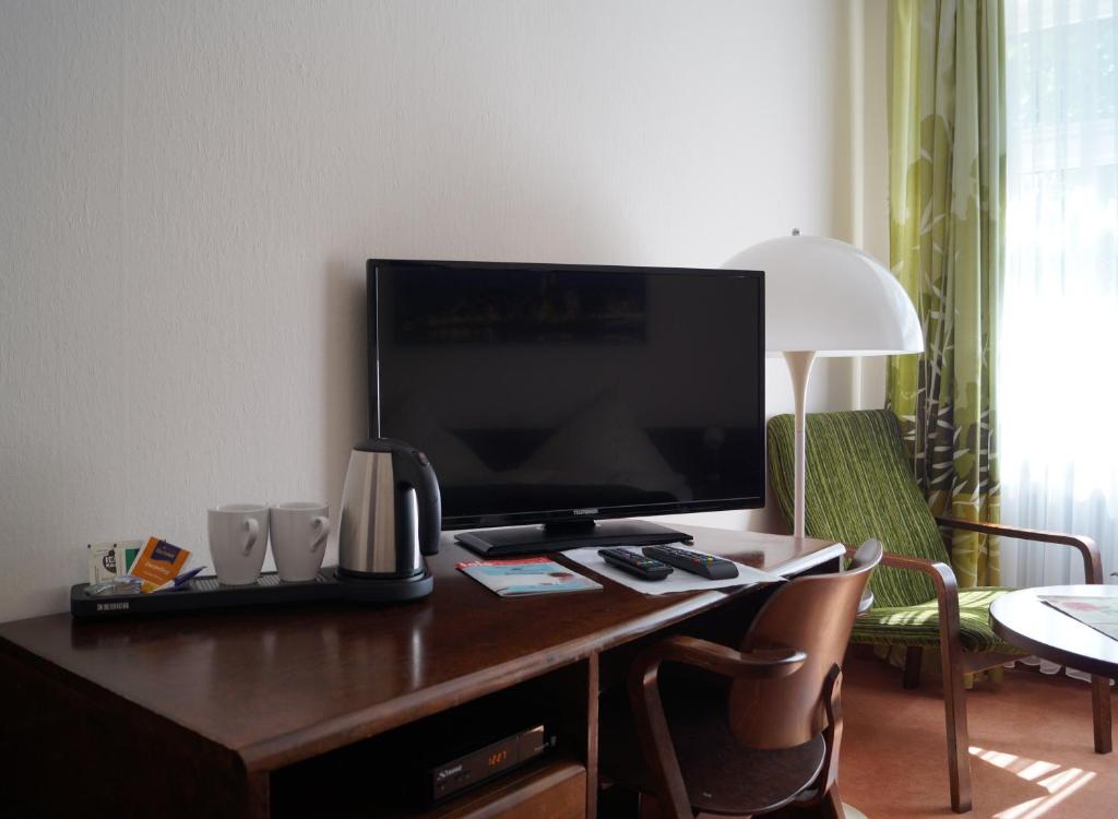 TV a/nebo společenská místnost v ubytování Hotel Forsthaus St. Hubertus