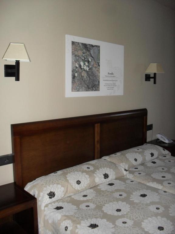 Postel nebo postele na pokoji v ubytování Hotel Zerbinetta