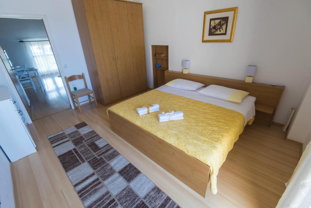 Postel nebo postele na pokoji v ubytování Apartments Onorina