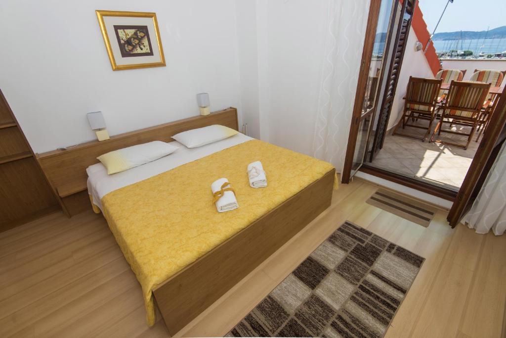 Postel nebo postele na pokoji v ubytování Apartments Onorina