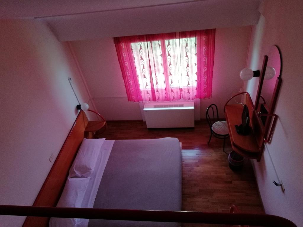 Postel nebo postele na pokoji v ubytování Hotel La Fonte