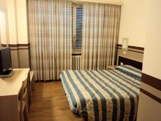 TV a/nebo společenská místnost v ubytování Hotel La Fonte