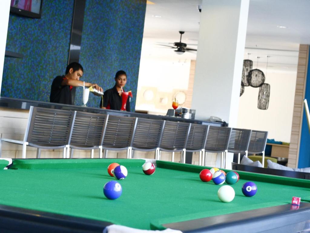 a pool table with balls on top of it at Ibis Phuket Kata in Kata Beach