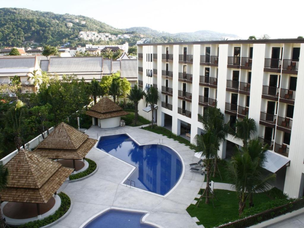 an aerial view of a building with a swimming pool at Ibis Phuket Kata in Kata Beach