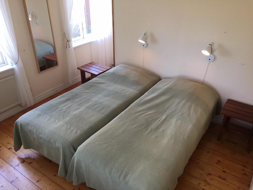 Postel nebo postele na pokoji v ubytování Wannborga Vingård