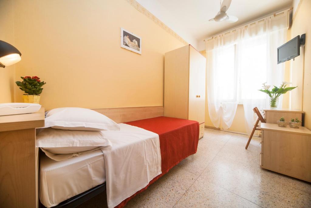 Postel nebo postele na pokoji v ubytování Hotel Festival