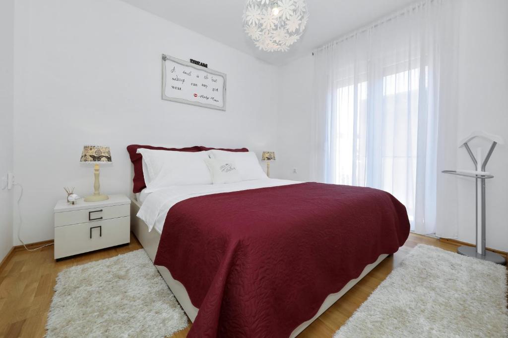 Posteľ alebo postele v izbe v ubytovaní Luxury Apartman Rita, Center