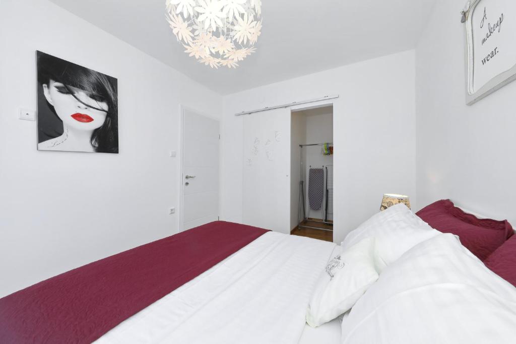 Posteľ alebo postele v izbe v ubytovaní Luxury Apartman Rita, Center