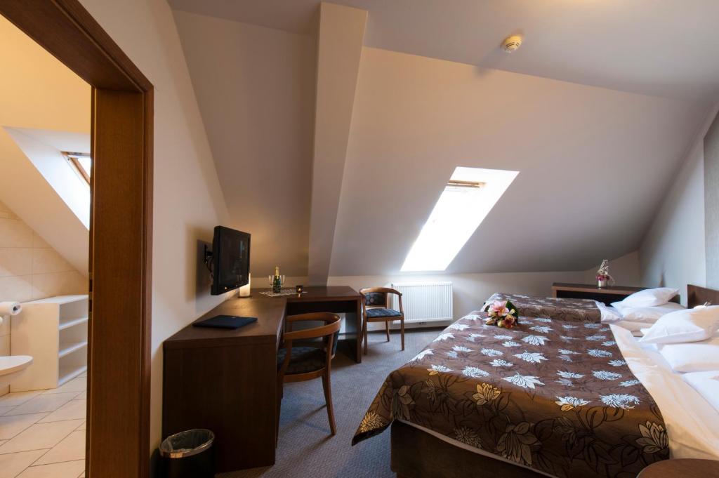 Postel nebo postele na pokoji v ubytování Hotel Mario