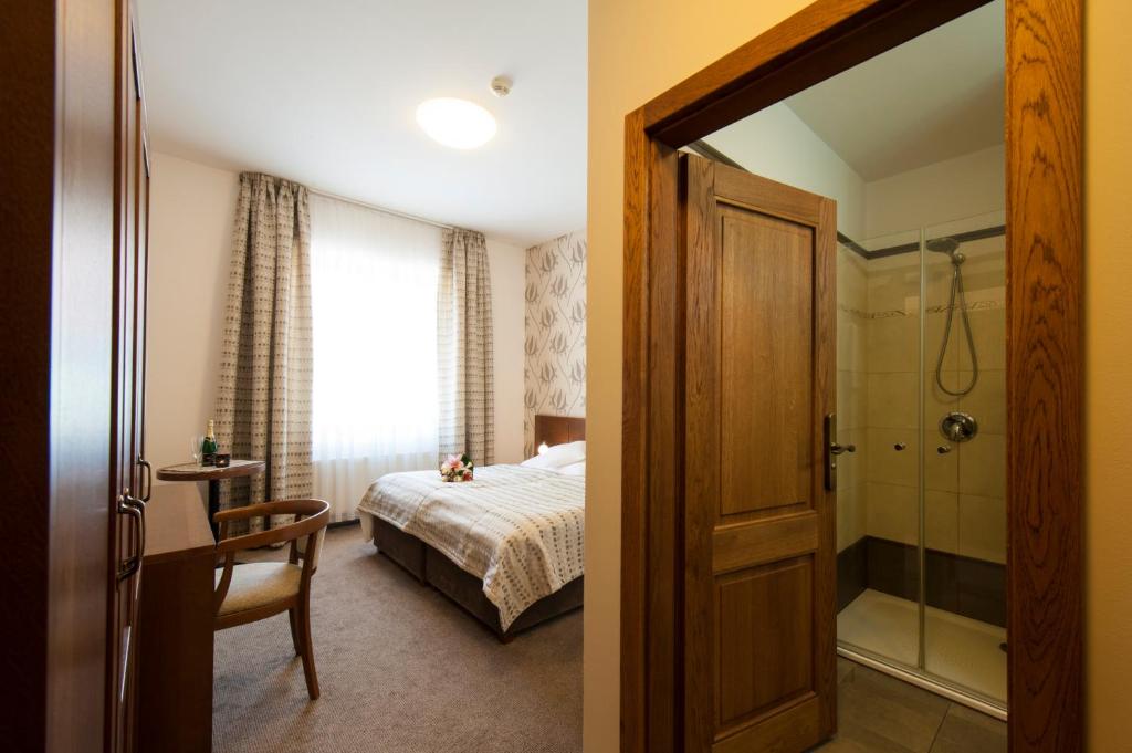 Postel nebo postele na pokoji v ubytování Hotel Mario