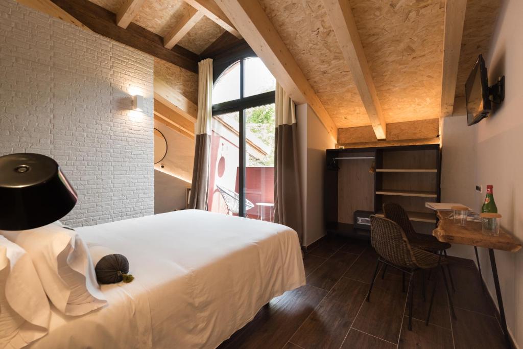 Postel nebo postele na pokoji v ubytování Hotel Rural Sagarlore
