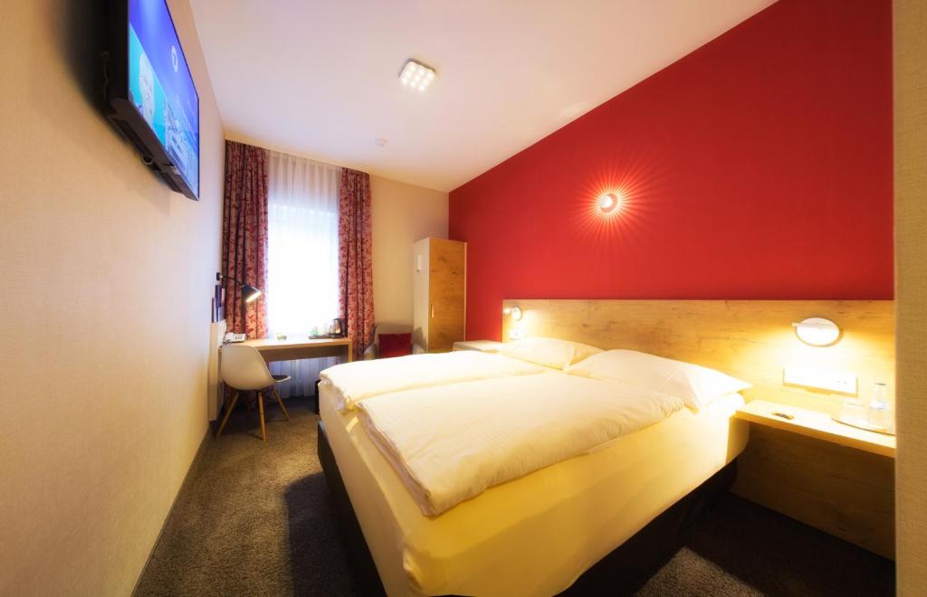 Postel nebo postele na pokoji v ubytování Hotel Azenberg