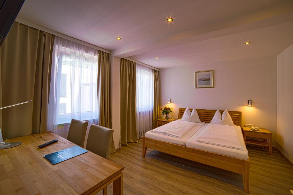 Postel nebo postele na pokoji v ubytování Hotel Central
