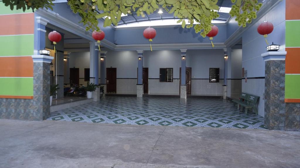 a building with a lobby with red lanterns on it at Motel Hoang Gia in Long Khanh