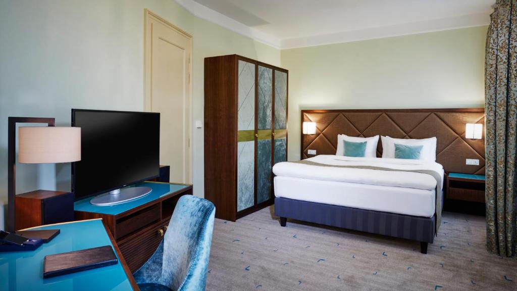 Postel nebo postele na pokoji v ubytování Aria Hotel Prague