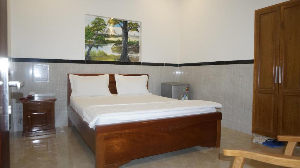 Postel nebo postele na pokoji v ubytování Motel Hoang Gia