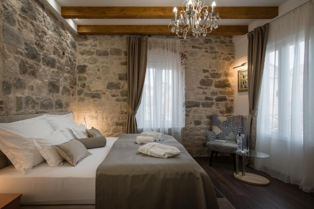 Posteľ alebo postele v izbe v ubytovaní ID Regal Residence