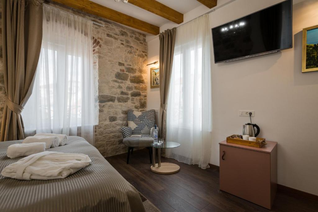 Posteľ alebo postele v izbe v ubytovaní ID Regal Residence