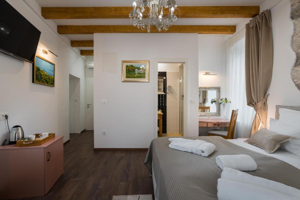 Posteľ alebo postele v izbe v ubytovaní ID Regal Residence
