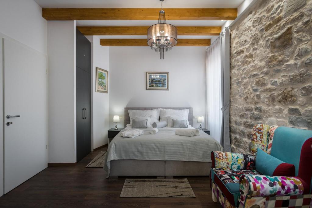 Posteľ alebo postele v izbe v ubytovaní ID Regal Residence