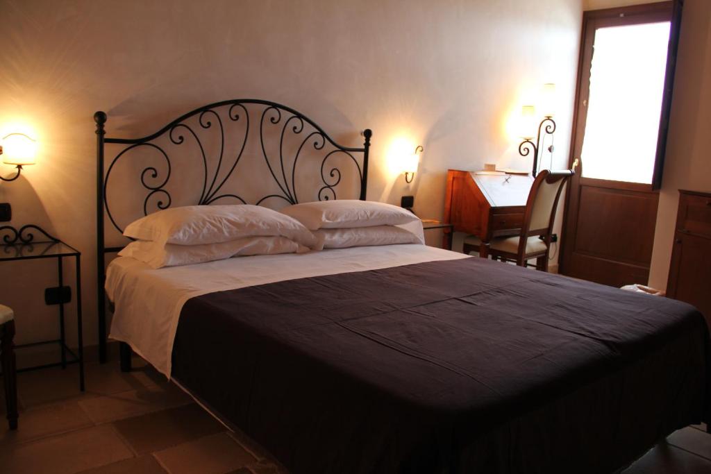 Postel nebo postele na pokoji v ubytování Hotel Masseria Fortificata Donnaloia