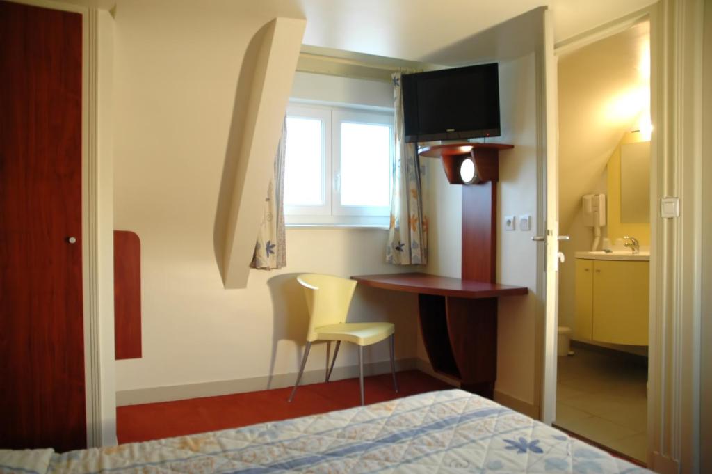 Postel nebo postele na pokoji v ubytování Citotel Les Sternes