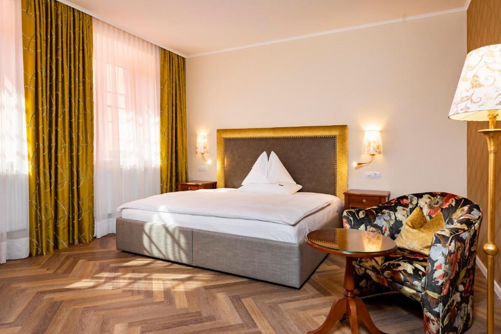 Postel nebo postele na pokoji v ubytování Parkhotel Graz - Traditional Luxury