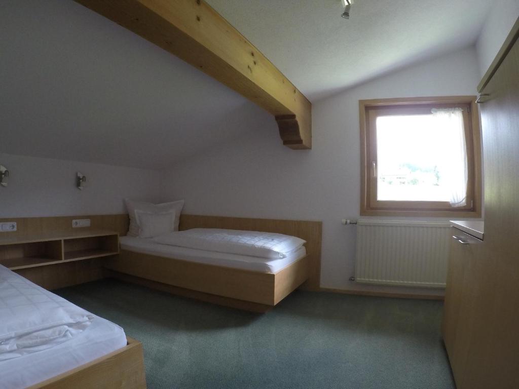 Postel nebo postele na pokoji v ubytování Ferienhaus Bergland