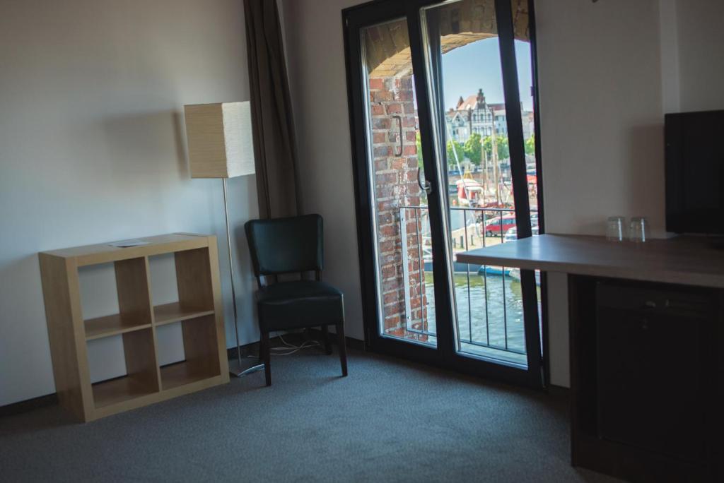 TV a/nebo společenská místnost v ubytování Hotel Alter Hafenspeicher