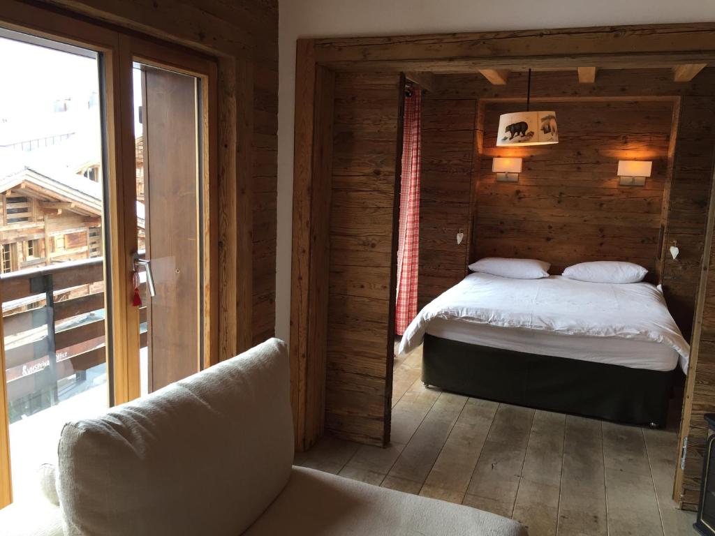 Postel nebo postele na pokoji v ubytování Verbier Valmont in center