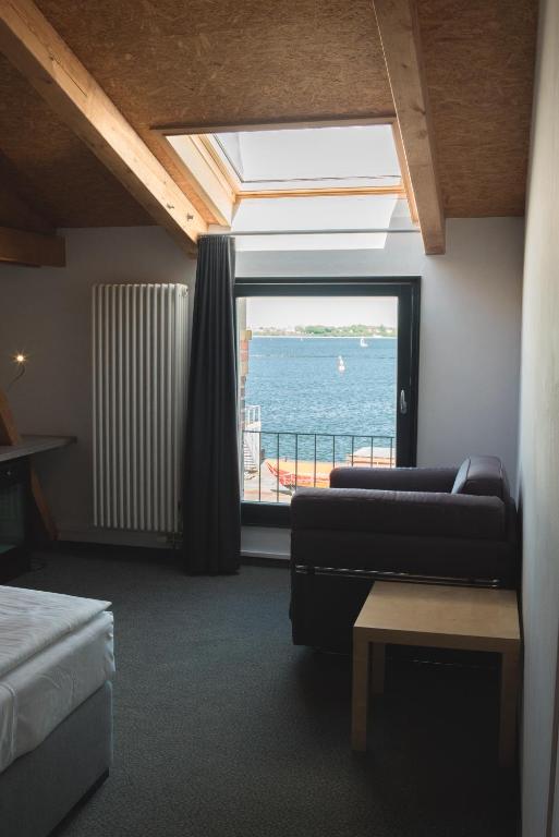 Postel nebo postele na pokoji v ubytování Hotel Alter Hafenspeicher